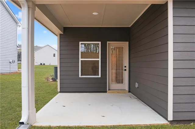 a view of a house with a yard and garage