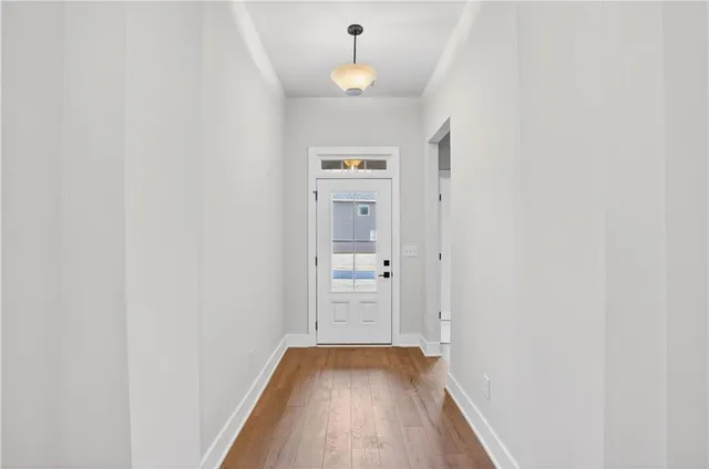 wooden floor in a hall with a window