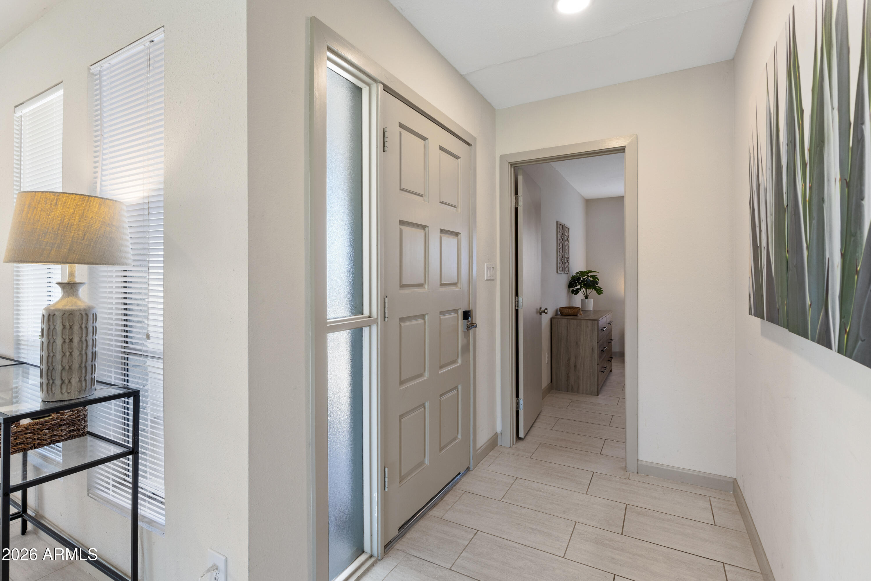 111 South Cholla Street Gilbert, AZ 85233 - Photo 3 of 34 a view of a hallway with a livingroom and a mirror
