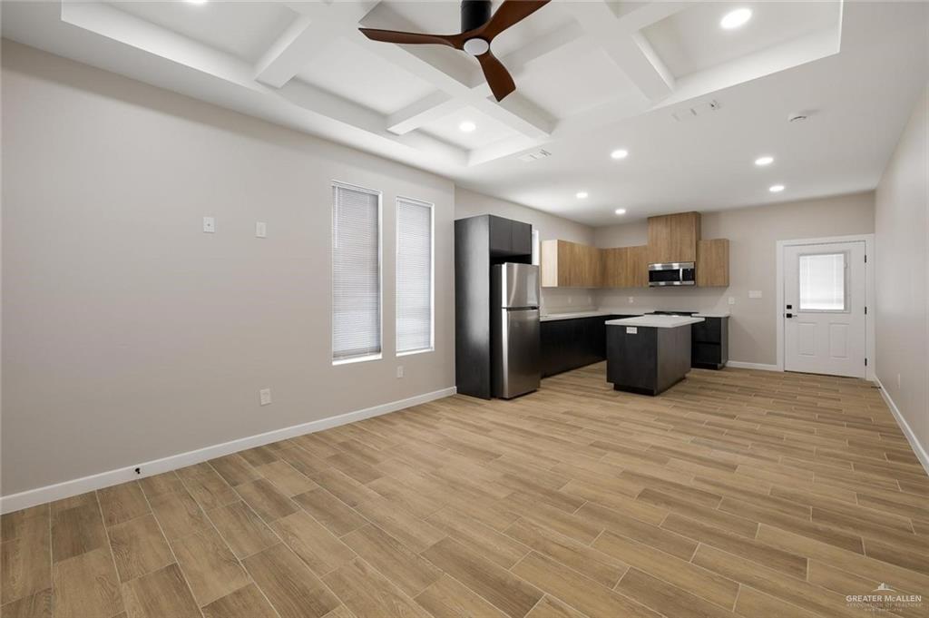 100 San Jose Drive, Unit 4 Mission, TX 78572 - Photo 11 of 11 a view of kitchen with stainless steel appliances refrigerator stove and microwave