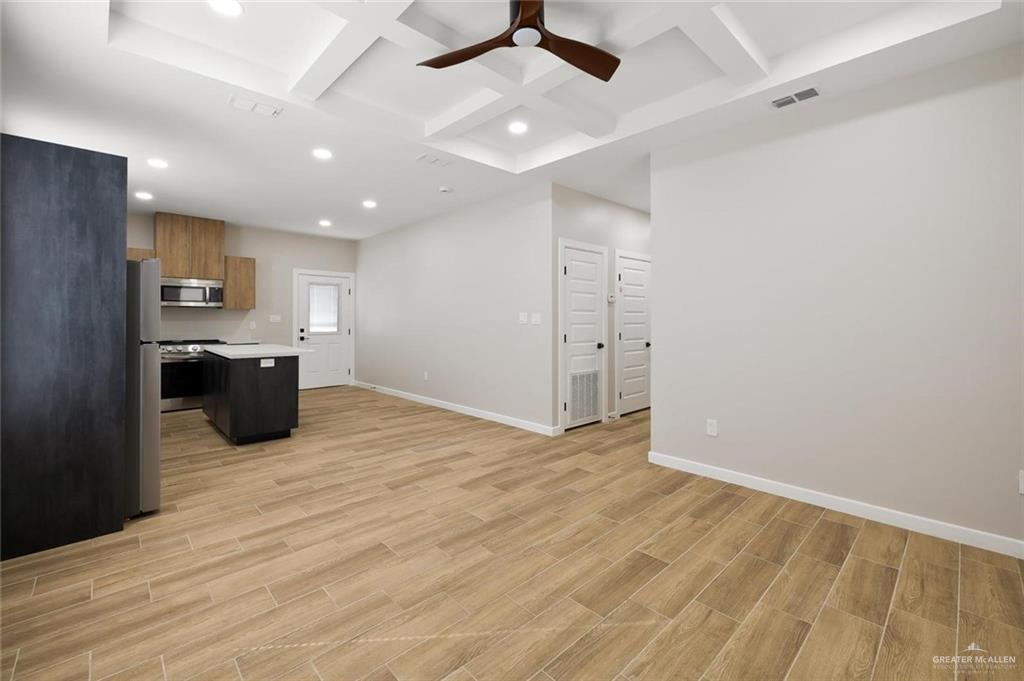 100 San Jose Drive, Unit 4 Mission, TX 78572 - Photo 4 of 11 an empty room with windows and ceiling fan