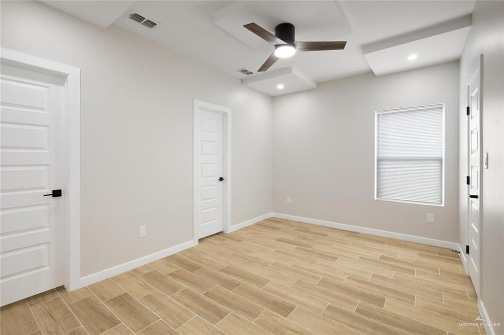 100 San Jose Drive, Unit 4 Mission, TX 78572 - Photo 6 of 11 wooden floor in an empty room