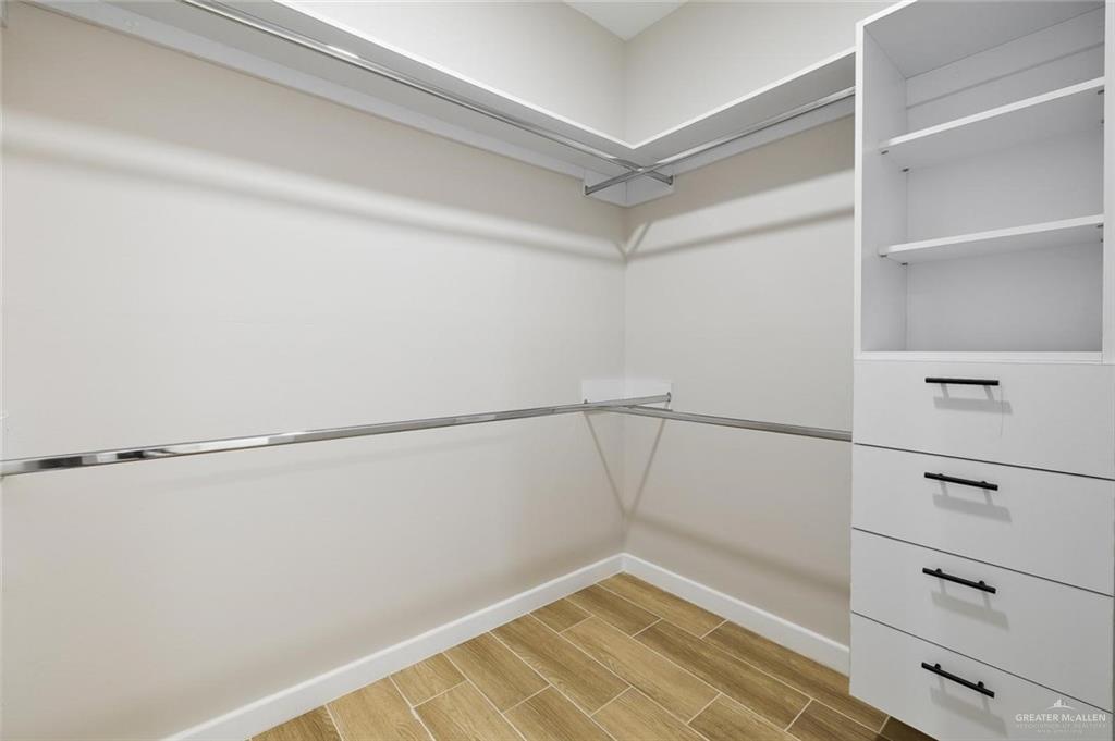 100 San Jose Drive, Unit 4 Mission, TX 78572 - Photo 7 of 11 a view of a room with racks on the wall