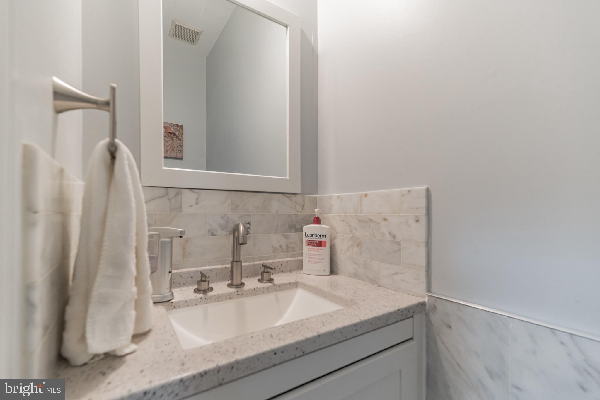 6501 Hubbardton Way Springfield, VA 22150 - Photo 17 of 29 a bathroom with a sink and a mirror