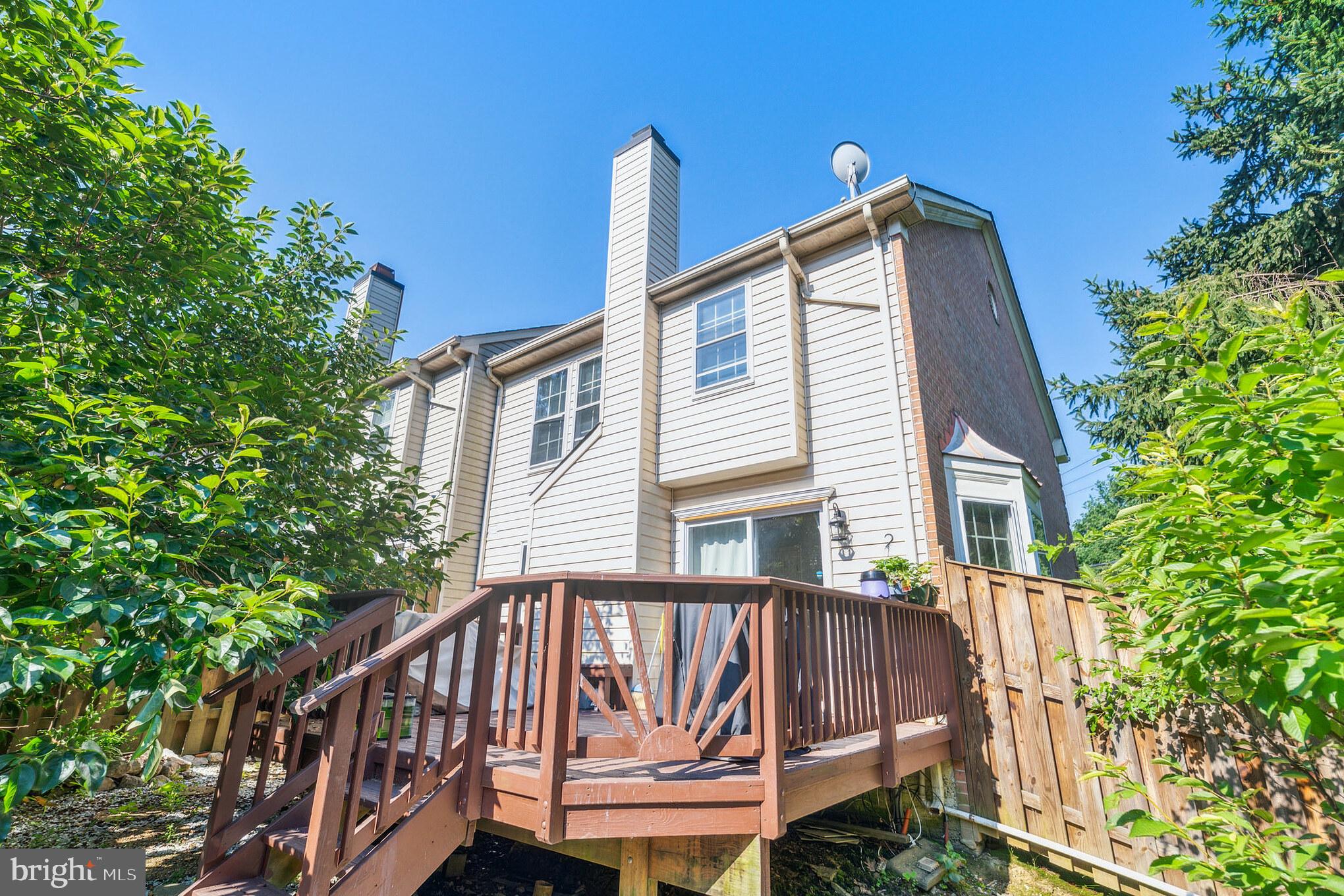 6501 Hubbardton Way Springfield, VA 22150 - Photo 29 of 29 a view of a house with a deck and a yard