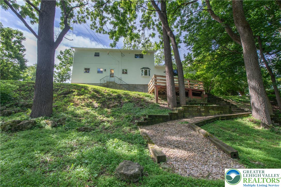 2011 Greenwood Road Allentown, PA 18103 - Photo 48 of 52 A tiered landscape leads up to this secluded hillside residence, framed by mature trees and a tranquil outdoor deck.