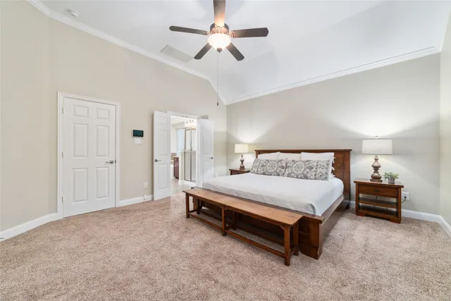 a bedroom with a bed and a tv