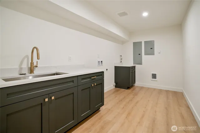 a kitchen with a sink and cabinets