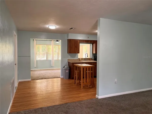 a view of an empty room with a window