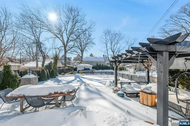a view of a patio with a table and chairs