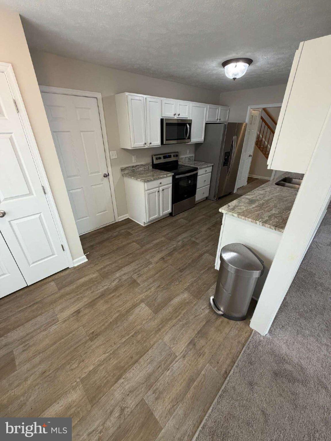 313 3rd Street Colonial Beach, VA 22443 - Photo 4 of 36 Modern kitchen with sleek finishes.