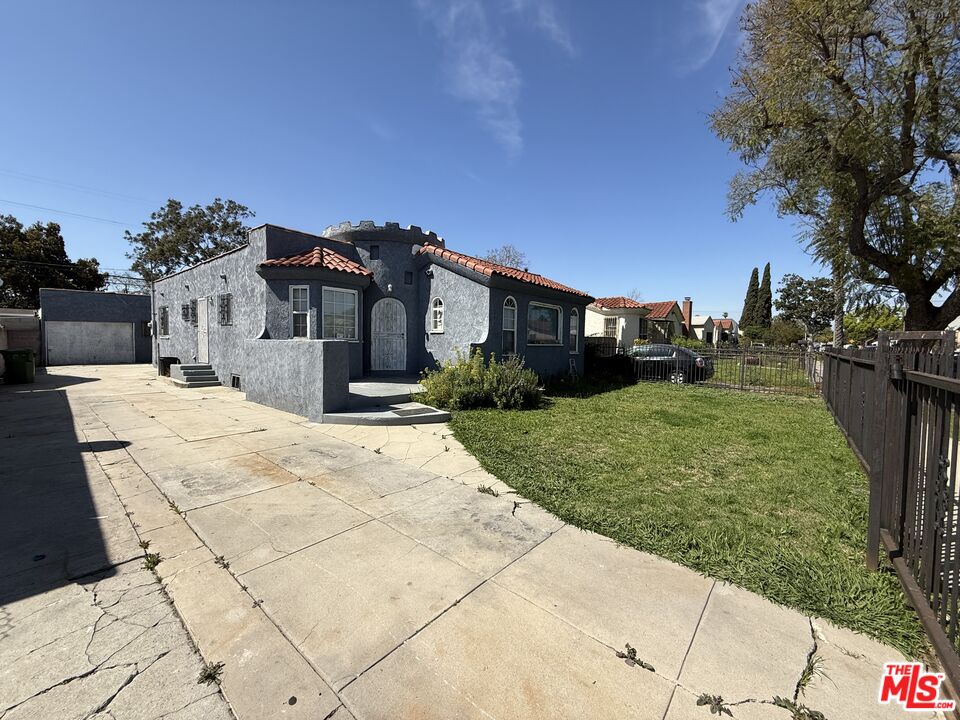 1415 North Spring Avenue Compton, CA 90221 - Photo 11 of 24 a view of a building with a yard