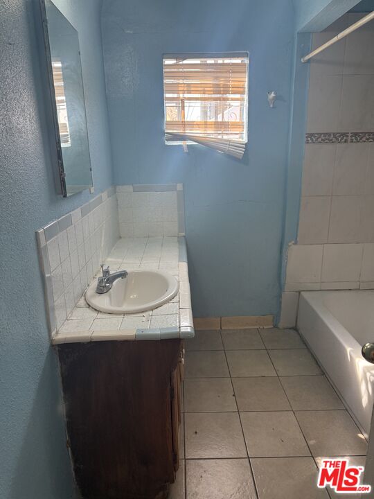 1415 North Spring Avenue Compton, CA 90221 - Photo 12 of 24 a bathroom with a sink and toilet