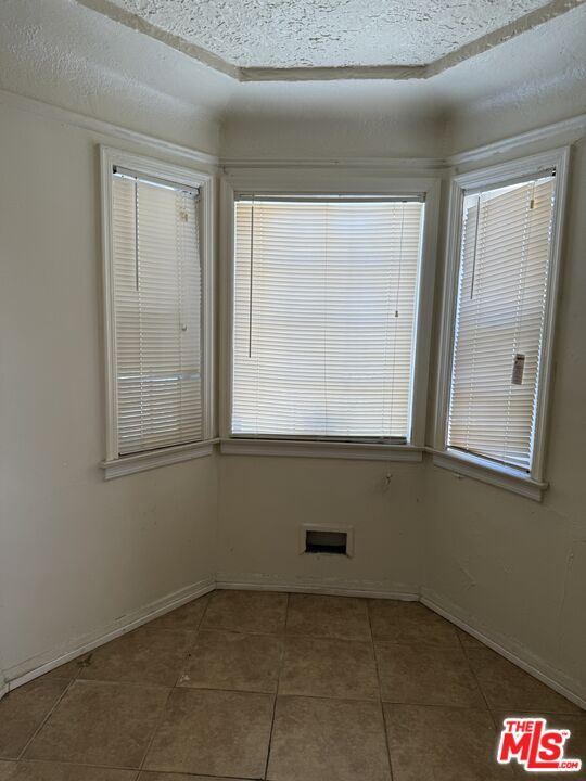 1415 North Spring Avenue Compton, CA 90221 - Photo 15 of 24 a view of an empty room with a window