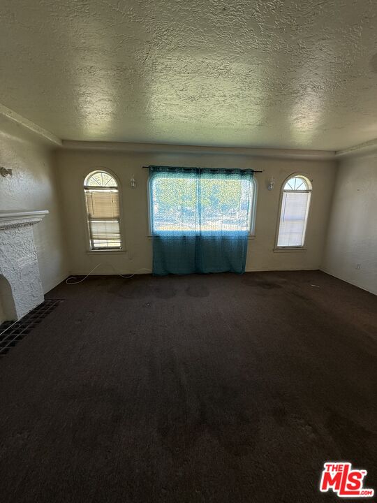 1415 North Spring Avenue Compton, CA 90221 - Photo 7 of 24 an empty room with windows
