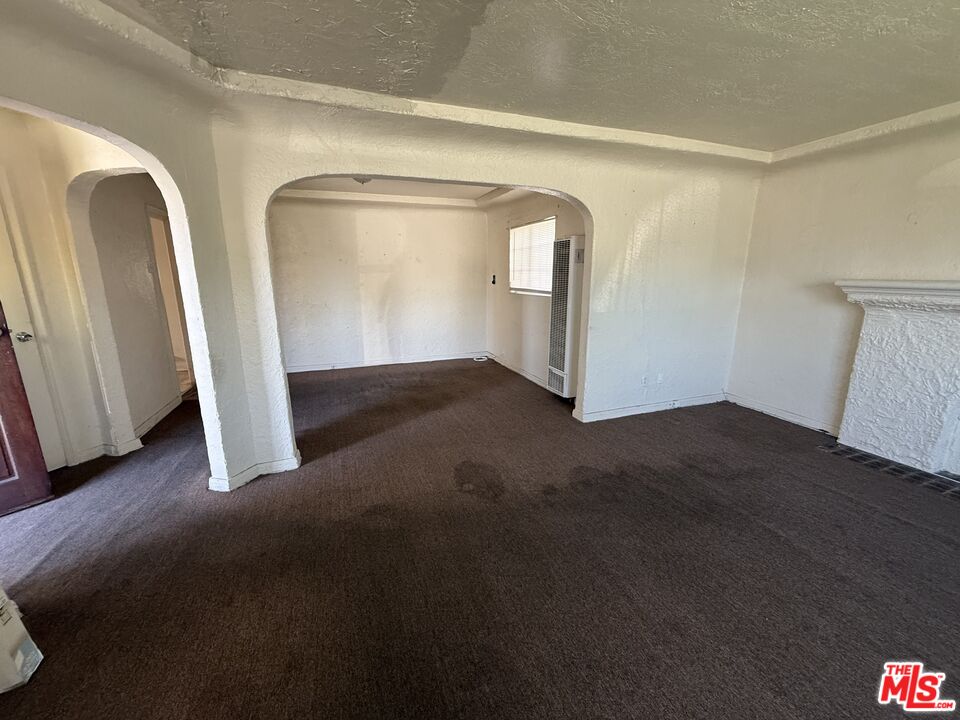 1415 North Spring Avenue Compton, CA 90221 - Photo 9 of 24 a view of empty room with wooden floor