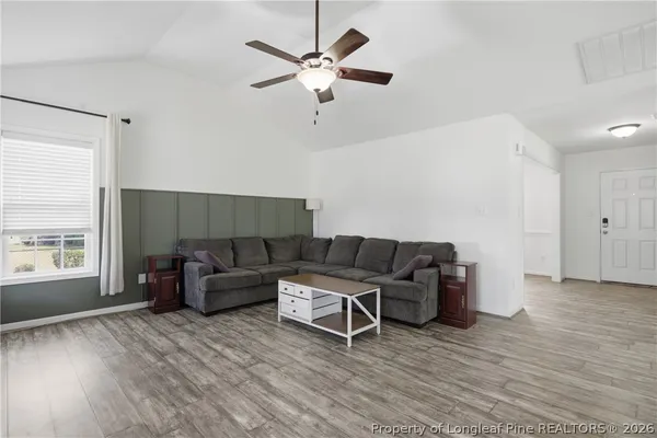 a living room with furniture and a window