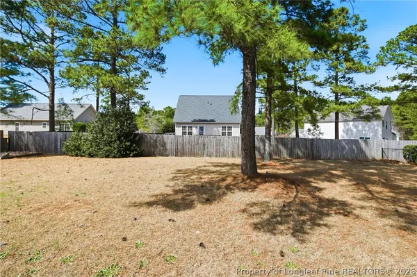 a view of a backyard of the house