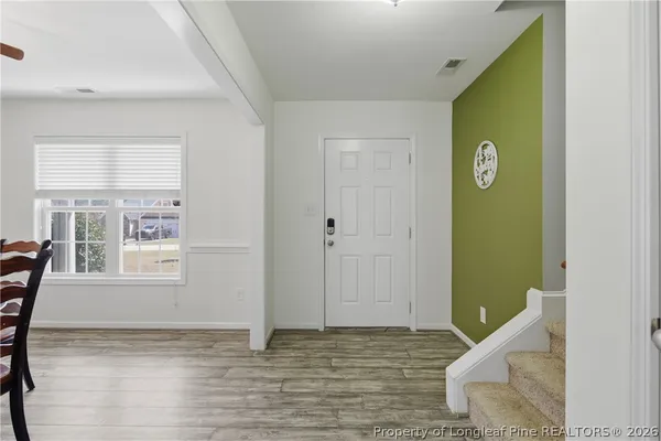 a view of an entryway with table and door