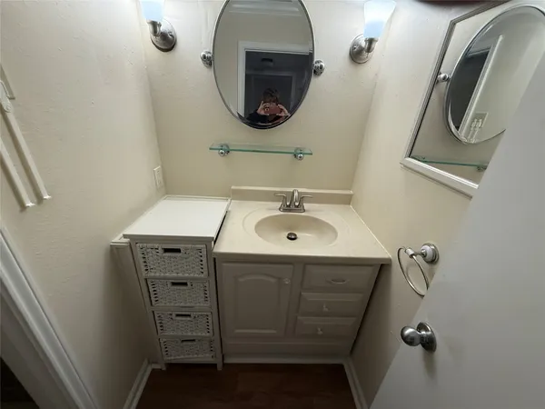 a bathroom with a sink and mirror