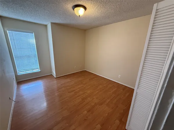 an empty room with wooden floor