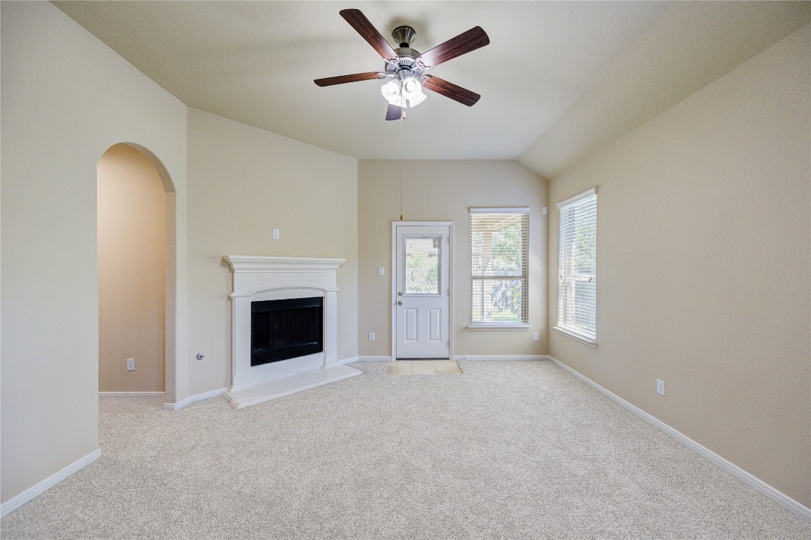 19306 Boulder Bay Lane Humble, TX 77346 - Photo 16 of 46 an empty room with windows and fireplace