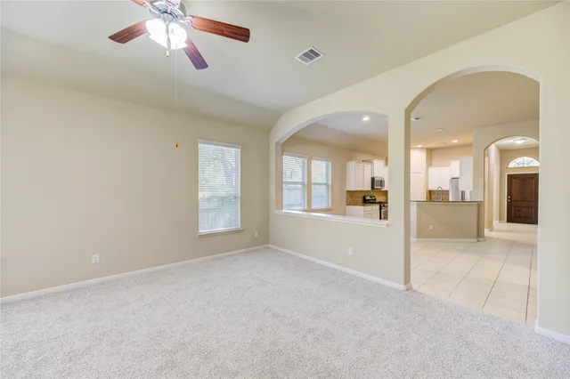 a view of a livingroom with a kitchen
