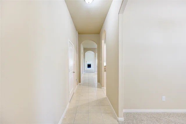 a view of a hallway with toilet