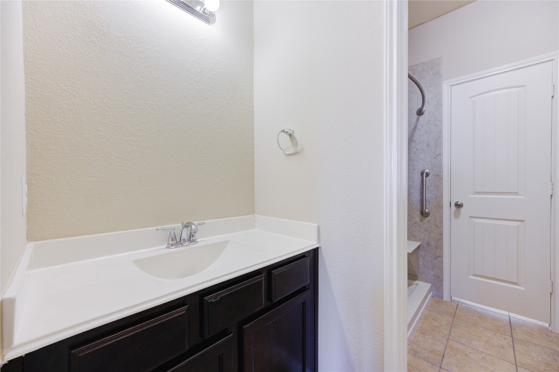 19306 Boulder Bay Lane Humble, TX 77346 - Photo 43 of 46 a bathroom with a sink and a mirror