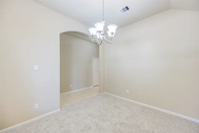 a view of a chandelier fan in a room