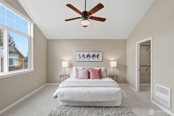 a bedroom with a bed and a window