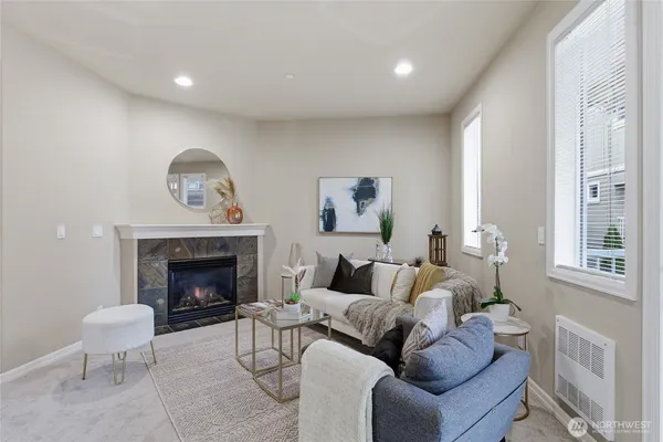 a living room with furniture and a fireplace