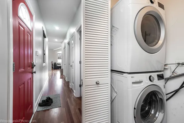 a view of a hallway with washer and dryer