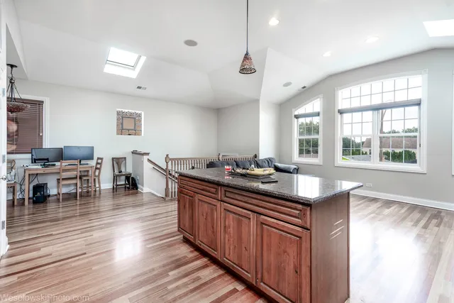 a kitchen with lots of counter top space and dining table