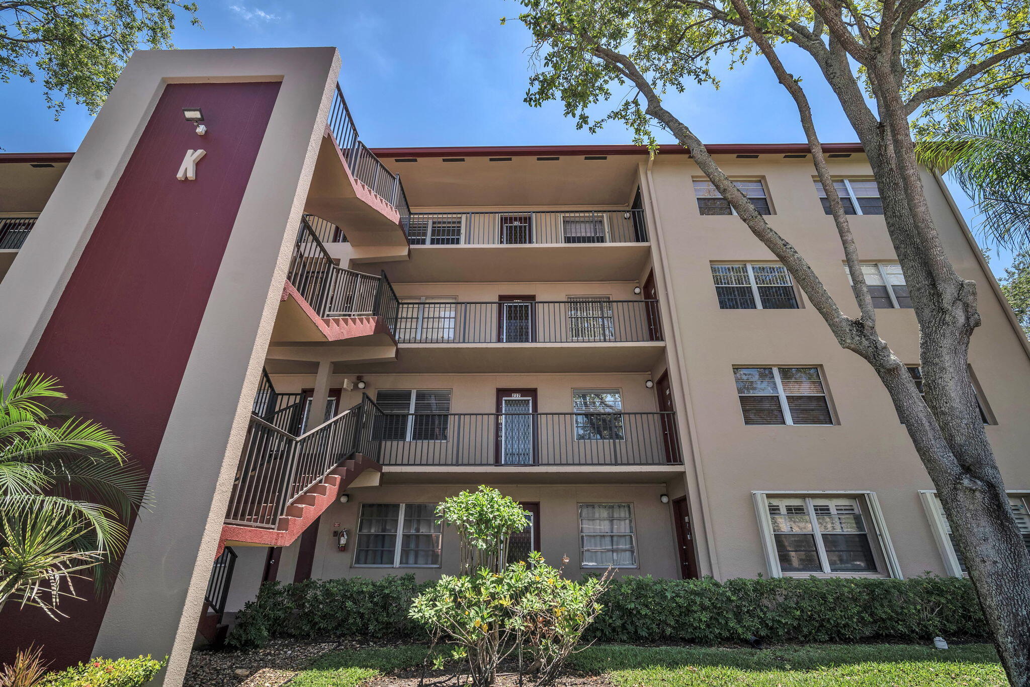 801 Southwest 133rd Terrace, Unit 317K Pembroke Pines, FL 33027 - Photo 11 of 13 a front view of a multi story residential apartment buildings