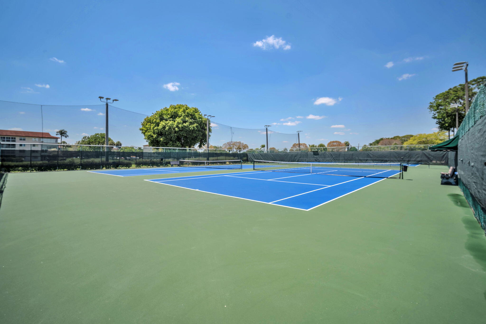 801 Southwest 133rd Terrace, Unit 317K Pembroke Pines, FL 33027 - Photo 13 of 13 a view of an outdoor space and tennis court