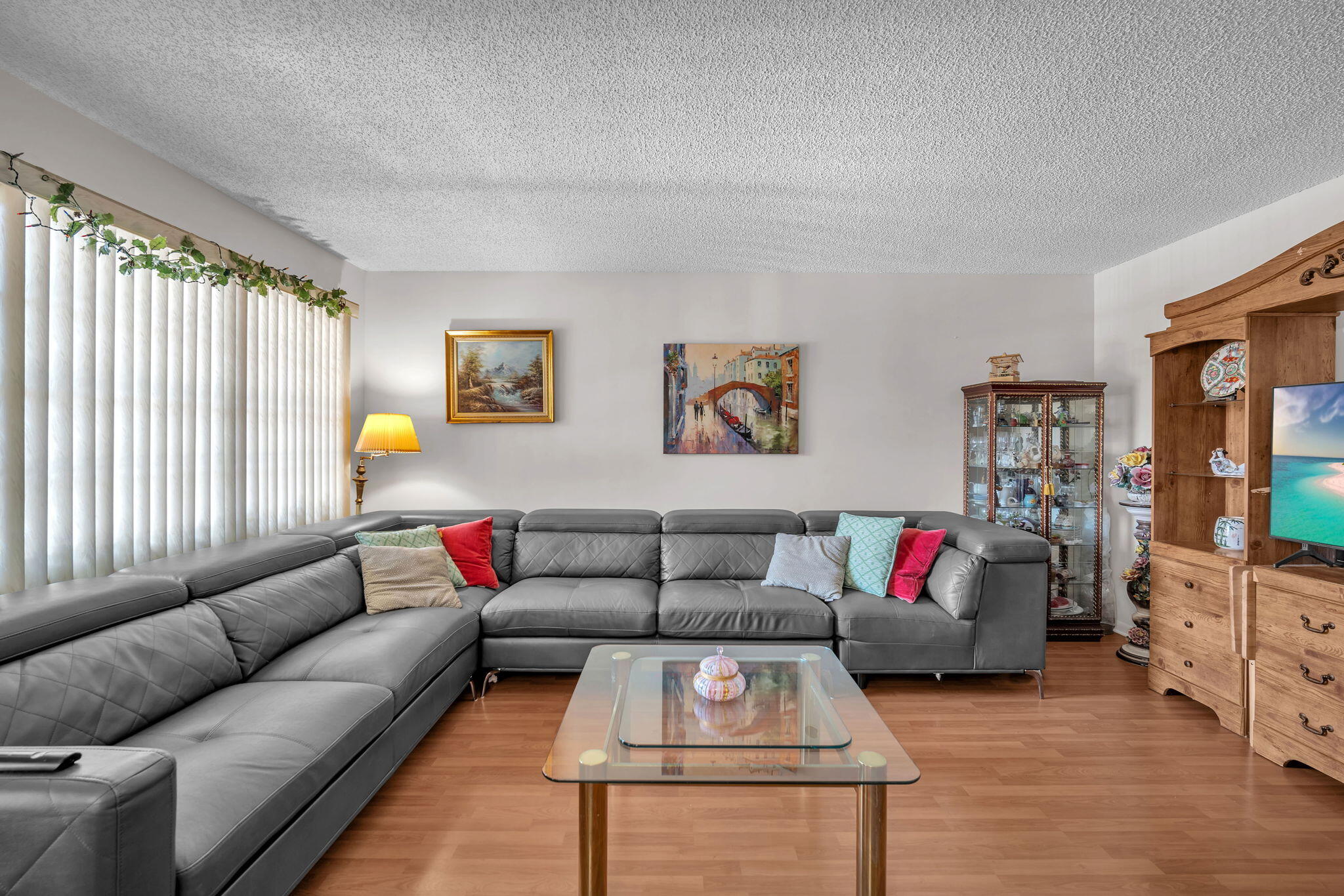 801 Southwest 133rd Terrace, Unit 317K Pembroke Pines, FL 33027 - Photo 4 of 13 a living room with furniture and a couch