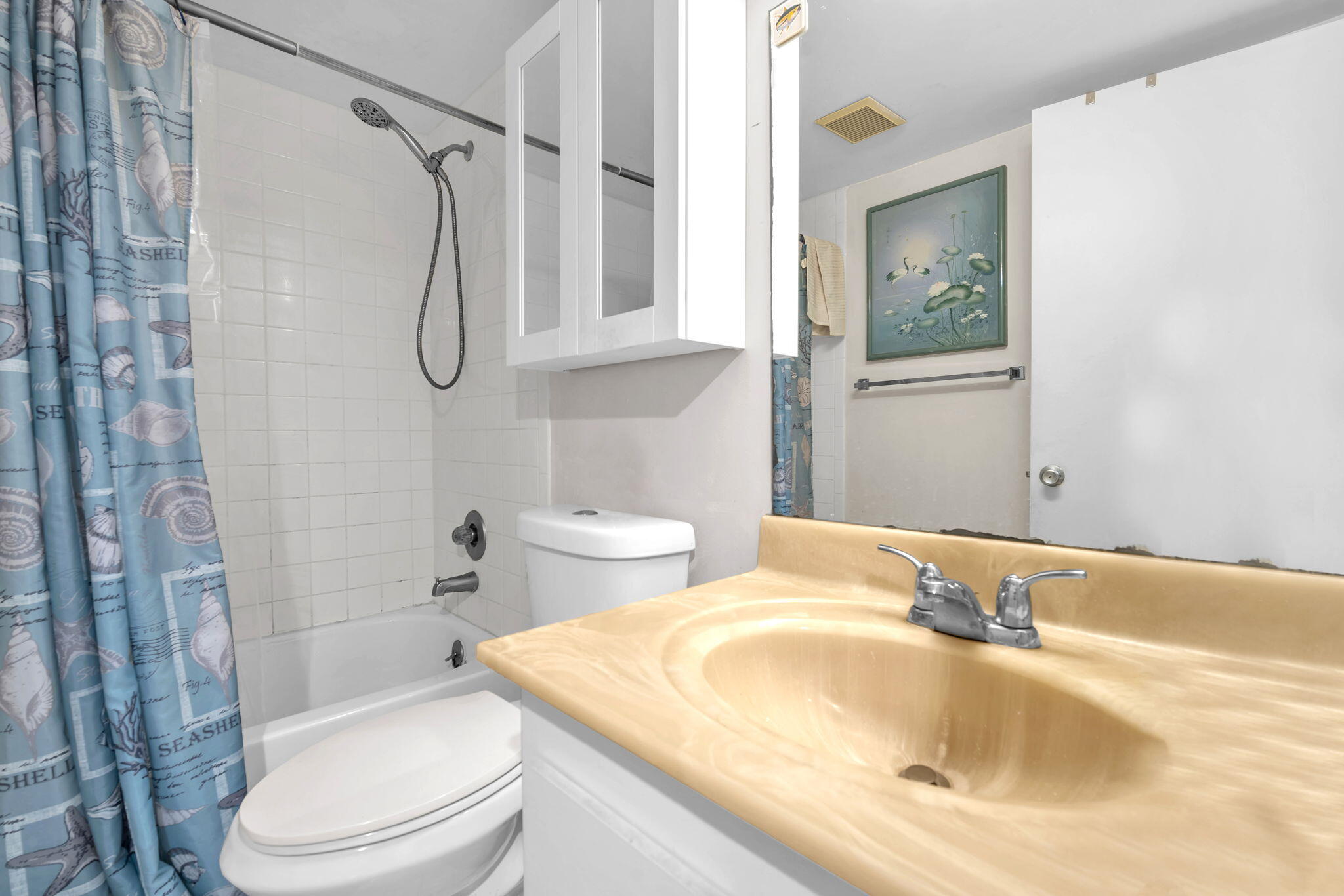 801 Southwest 133rd Terrace, Unit 317K Pembroke Pines, FL 33027 - Photo 9 of 13 a bathroom with a sink toilet and shower