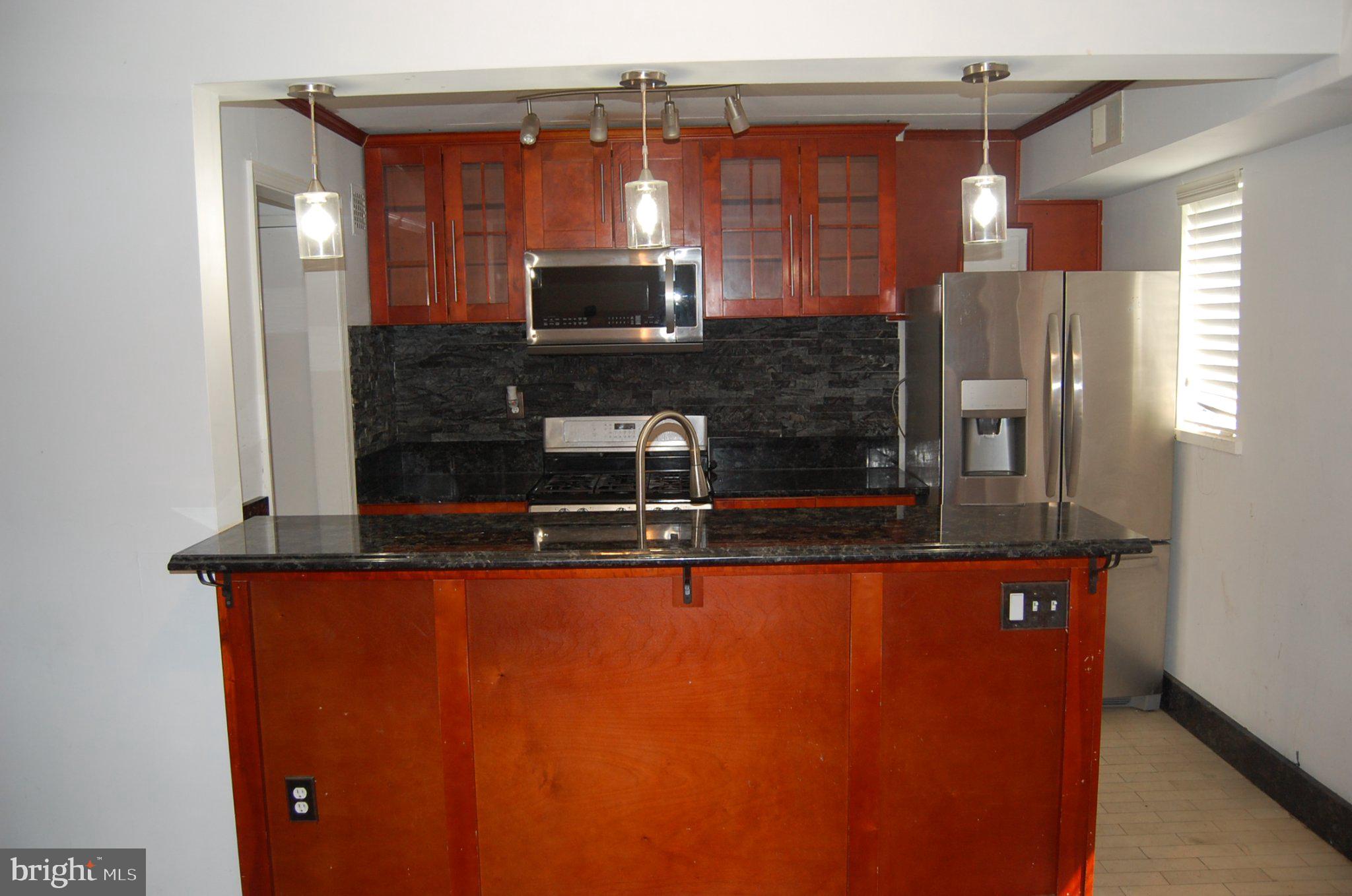 3346 Hewitt Avenue, Unit 11A Silver Spring, MD 20906 - Photo 4 of 8 Modern kitchen with sleek finishes.