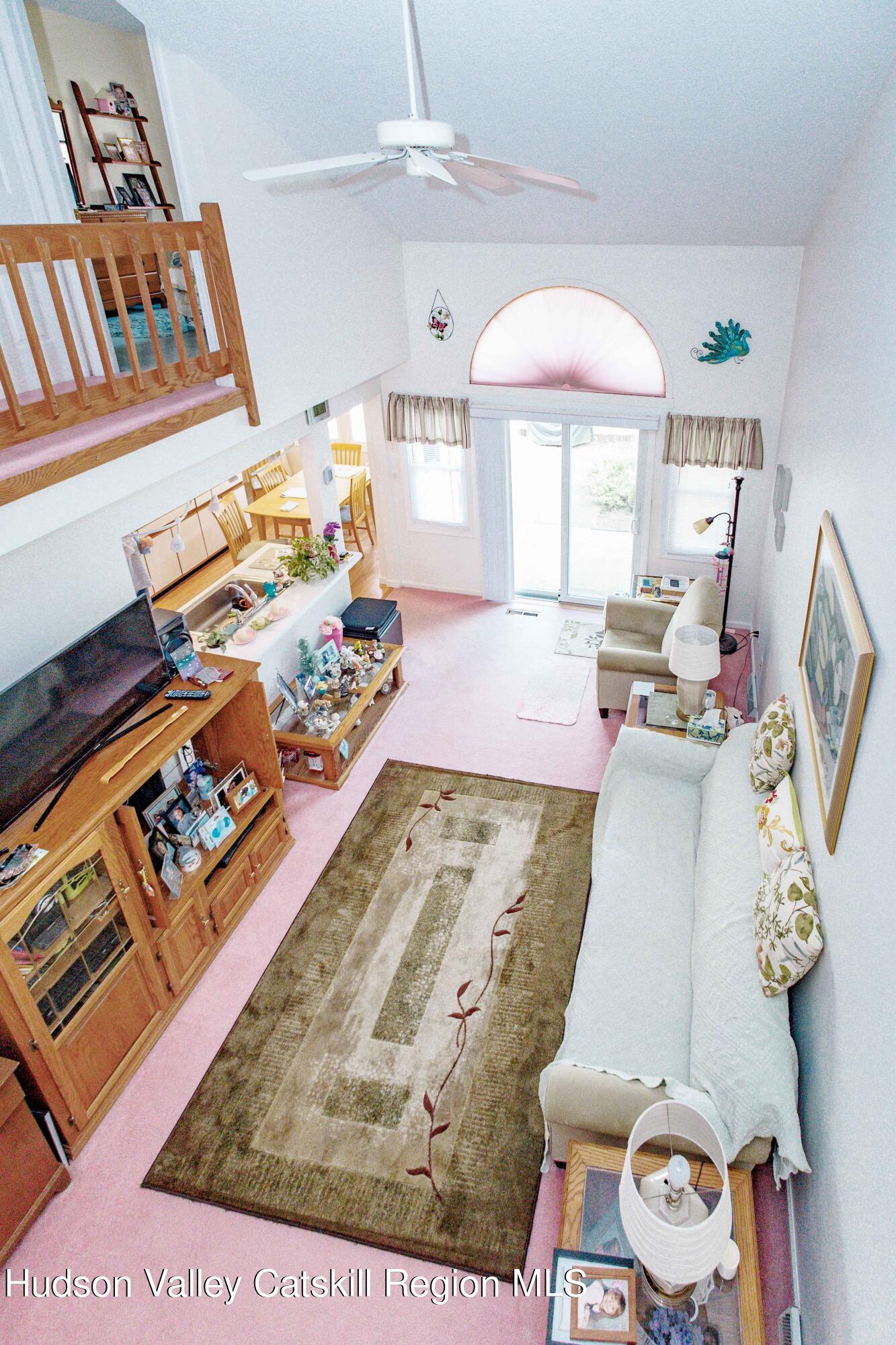 6 Red Maple Road Saugerties, NY 12477 - Photo 3 of 13 a bedroom with a bed mirror and a window