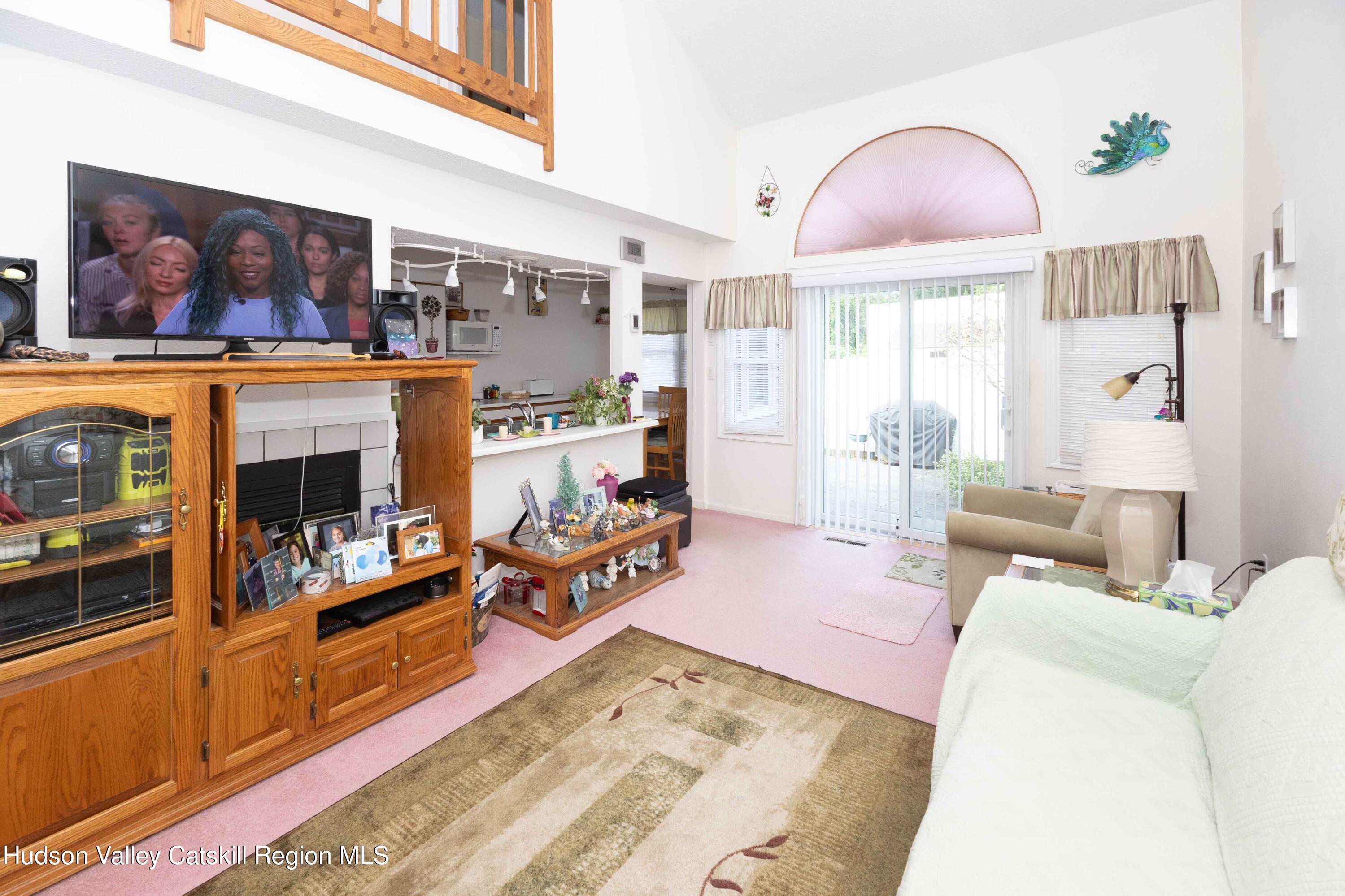 6 Red Maple Road Saugerties, NY 12477 - Photo 4 of 13 a living room with furniture and a flat screen tv