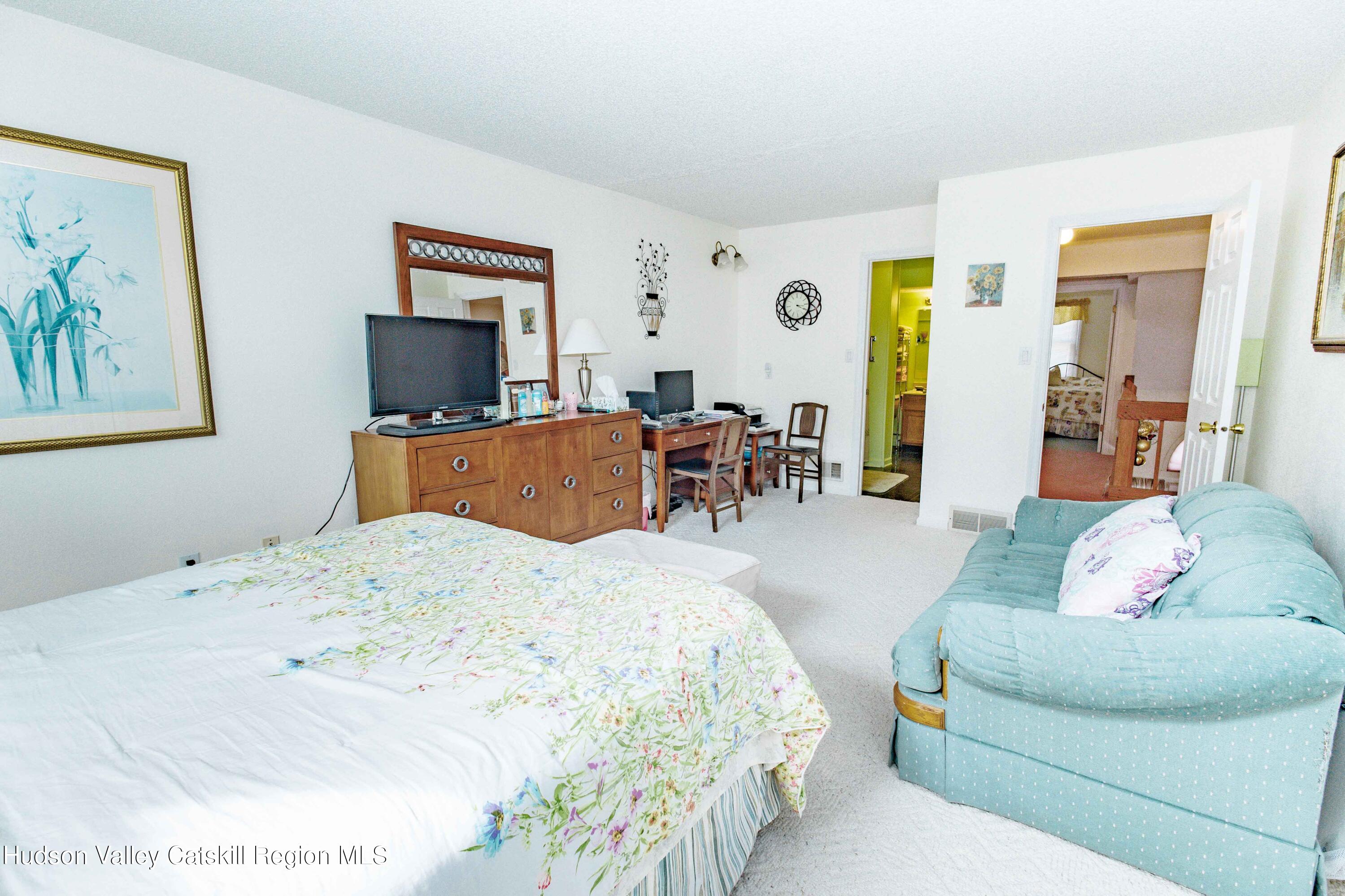6 Red Maple Road Saugerties, NY 12477 - Photo 9 of 13 a living room with furniture and a flat screen tv