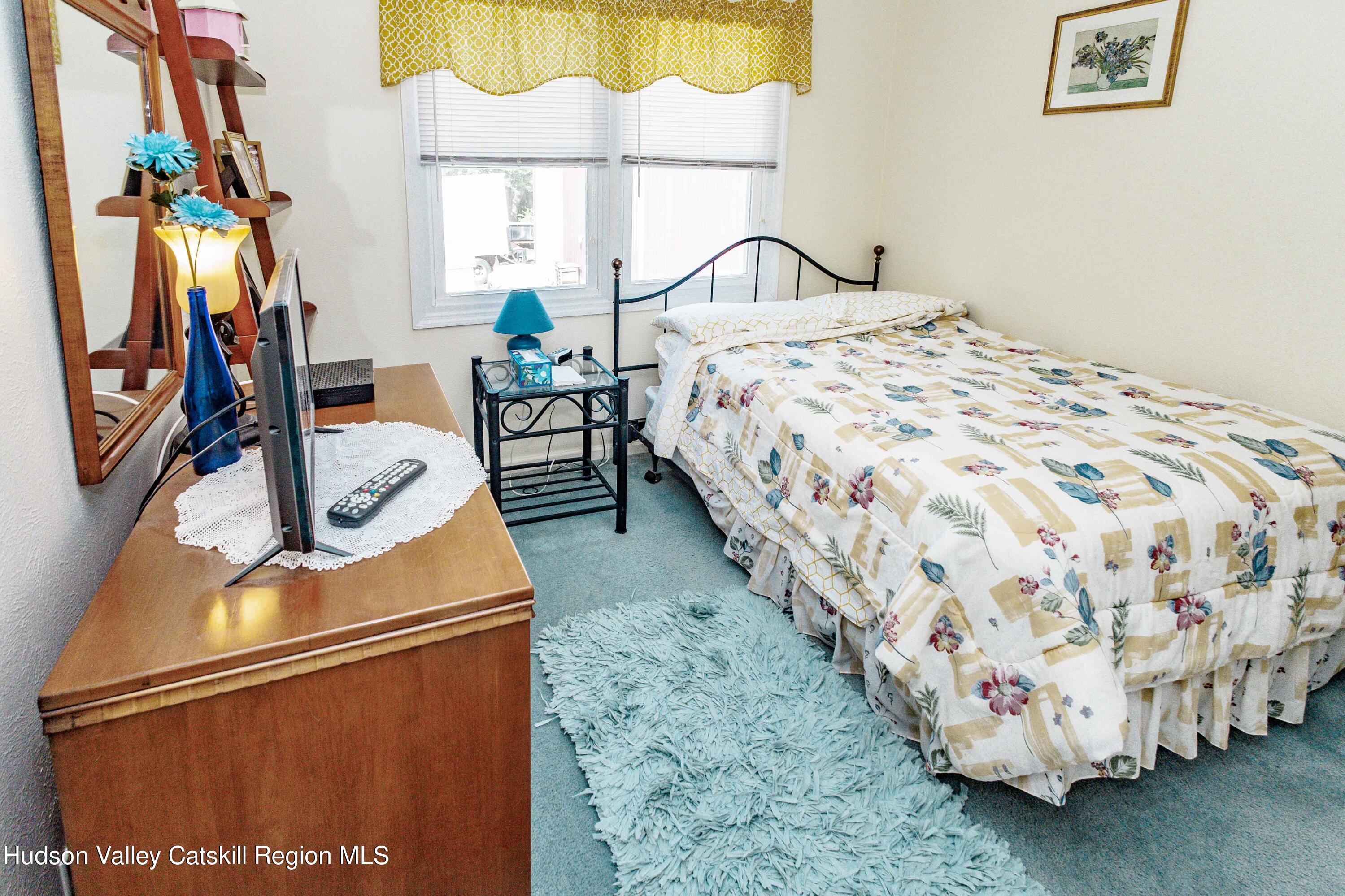 6 Red Maple Road Saugerties, NY 12477 - Photo 10 of 13 a bedroom with a bed and a window