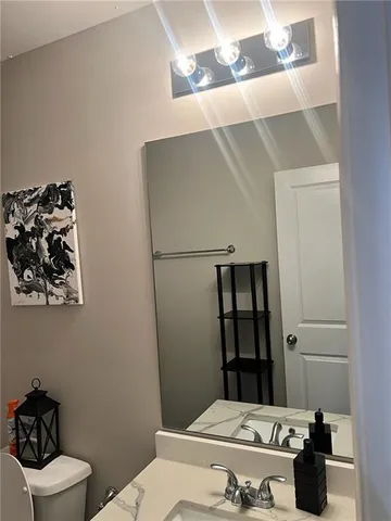 a bathroom with a sink and toilet