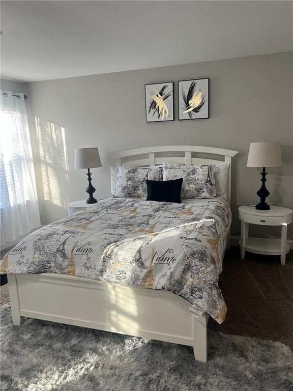 7150 Fringe Flower Drive, Unit 20 Austell, GA 30168 - Photo 23 of 41 a bedroom with a bed and a couch