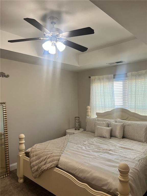 7150 Fringe Flower Drive, Unit 20 Austell, GA 30168 - Photo 29 of 41 a bedroom with a bed and a chandelier