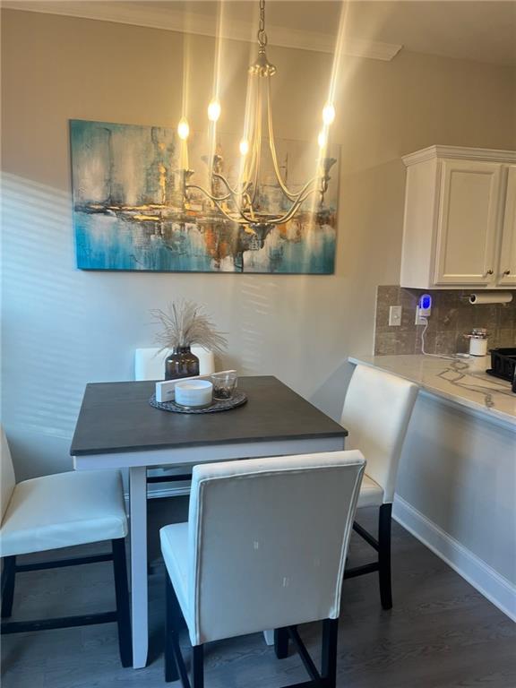 7150 Fringe Flower Drive, Unit 20 Austell, GA 30168 - Photo 31 of 41 a view of a dining room with furniture and wooden floor