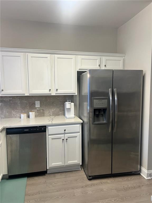 7150 Fringe Flower Drive, Unit 20 Austell, GA 30168 - Photo 35 of 41 a kitchen with stainless steel appliances granite countertop a refrigerator and a sink