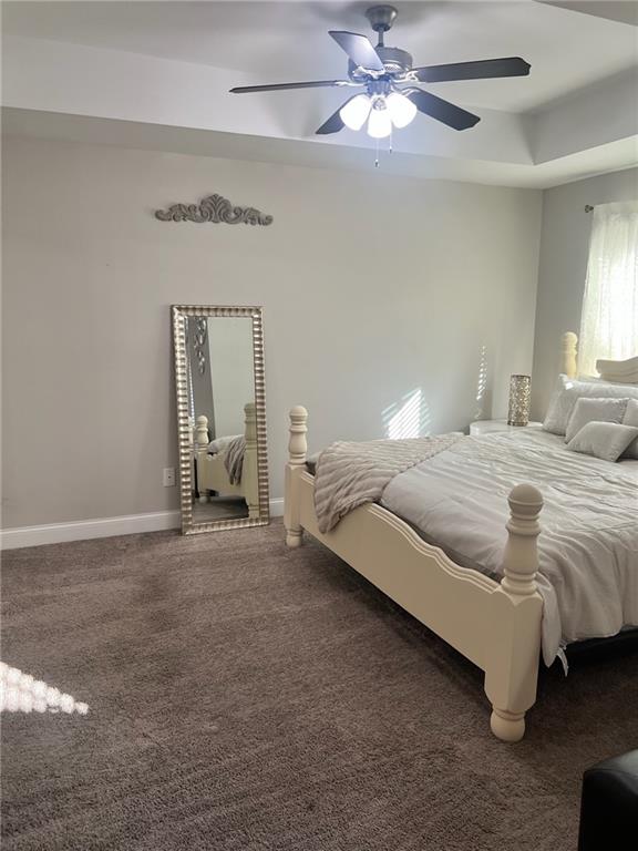 7150 Fringe Flower Drive, Unit 20 Austell, GA 30168 - Photo 6 of 41 a spacious bedroom with a bed and a chandelier