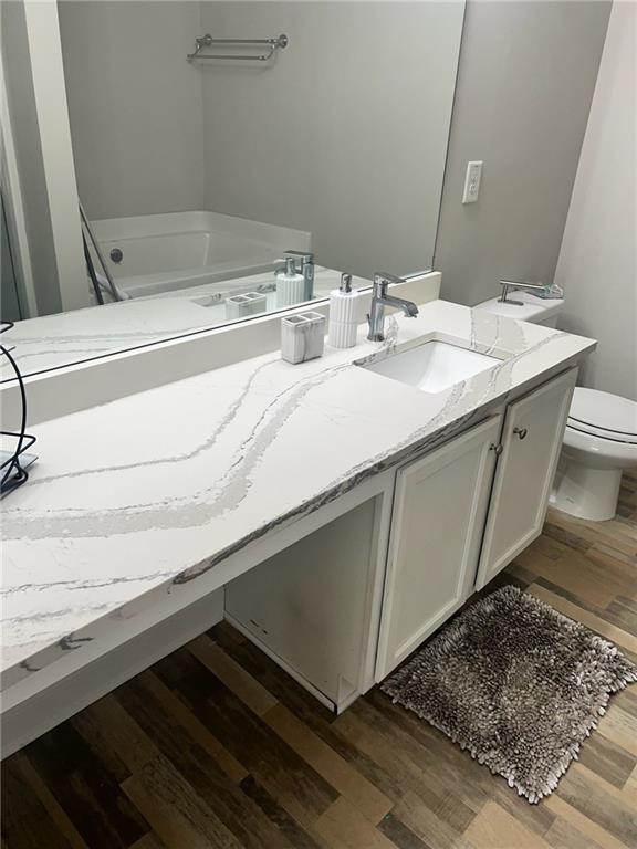 7150 Fringe Flower Drive, Unit 20 Austell, GA 30168 - Photo 9 of 41 a bathroom with a sink and a mirror
